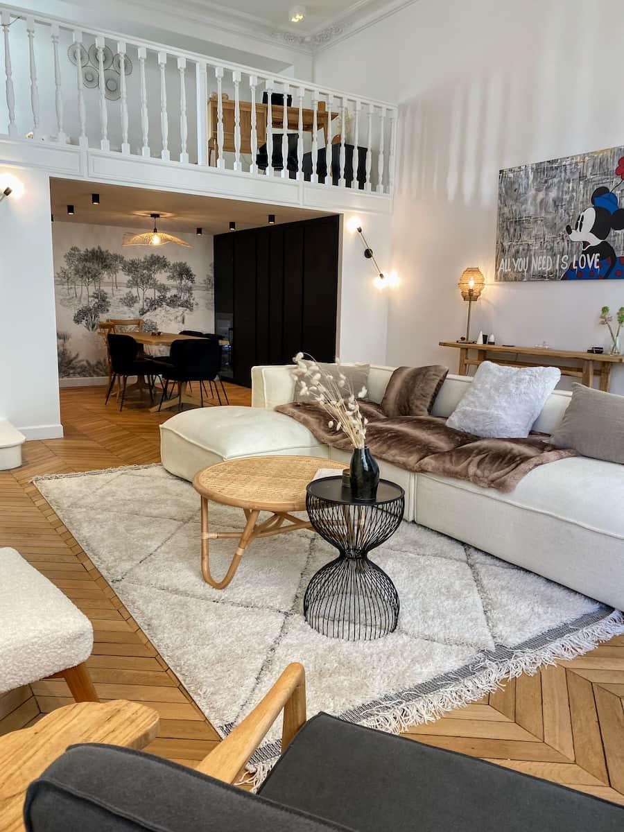 The sitting area, corner sofa and Berber rug, below the mezzanine